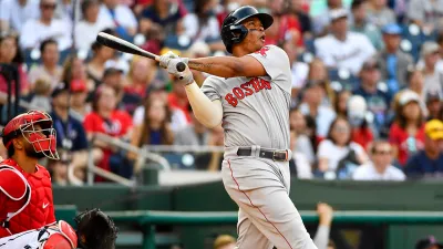 Oct 2, 2021; Washington, District of Columbia, USA; Boston Red Sox third baseman Rafael Devers (11) hits a solo home run against the Washington Nationals during the fourth inning at Nationals Park. Mandatory Credit: Brad Mills-USA TODAY Sports