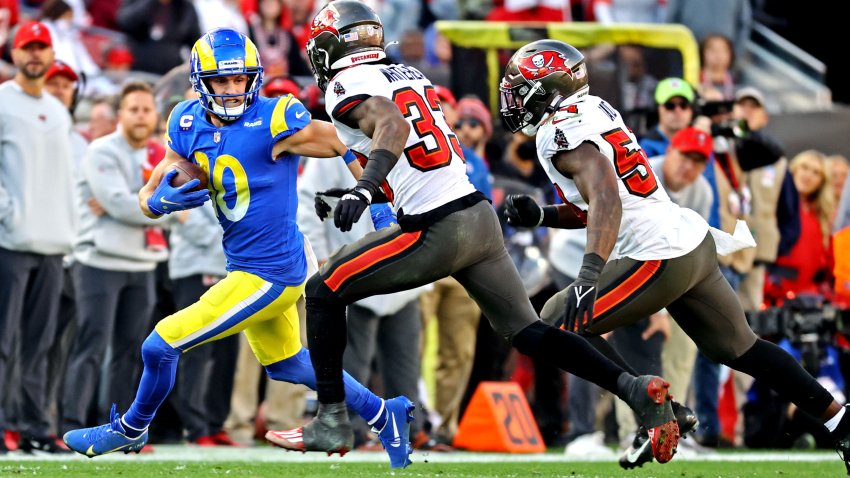 Jan 23, 2022; Tampa, Florida, USA; Los Angeles Rams wide receiver Cooper Kupp (10) runs the ball against Tampa Bay Buccaneers free safety Jordan Whitehead (33) during the second half in a NFC Divisional playoff football game at Raymond James Stadium. Mandatory Credit: Kim Klement-USA TODAY Sports