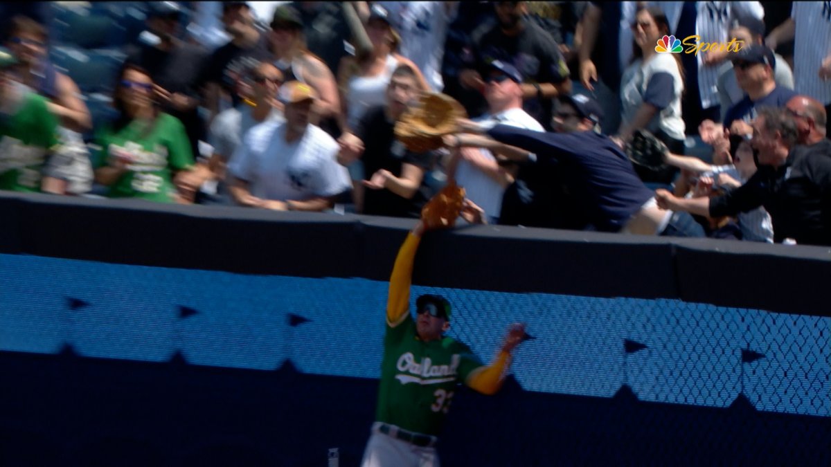 Athletics on wrong end of apparent fan interference in loss to Yankees
