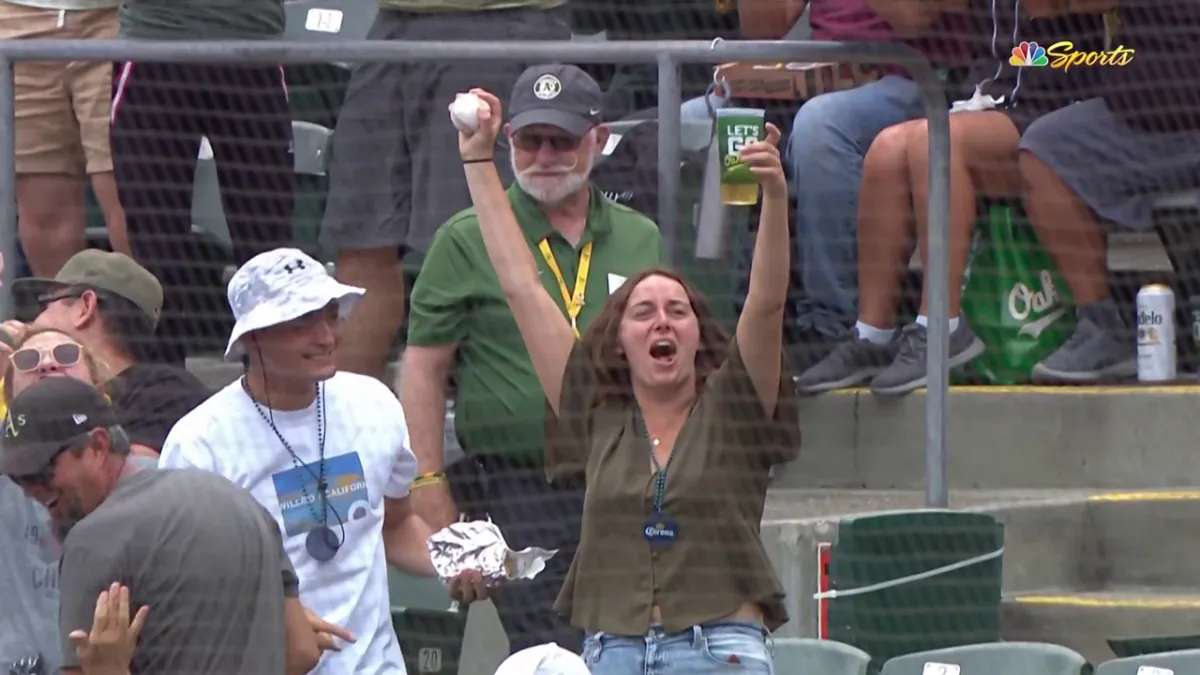 Athletics fan impressively chugs beer after incredible barehanded catch