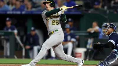 Brent Rooker #25 of the Oakland Athletics doubles during the 4th inning of the game against the Kansas City Royals at Kauffman Stadium on May 05, 2023 in Kansas City, Missouri. (Photo by Jamie Squire/Getty Images)