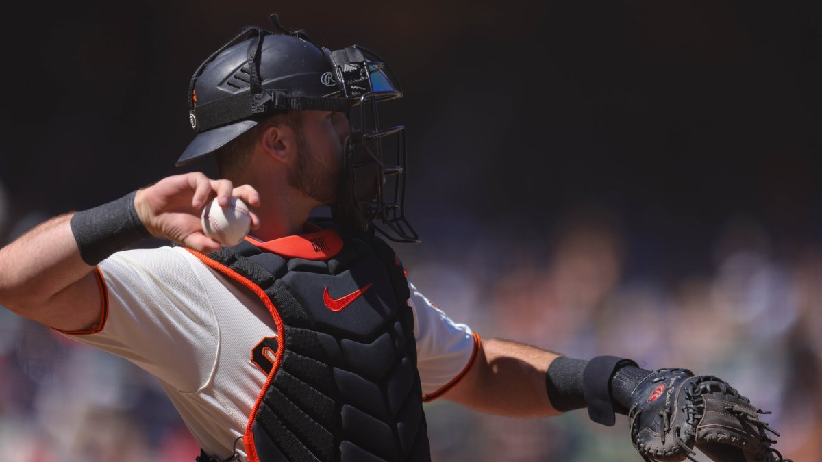 Joey Bart of the San Francisco Giants throws a baseball during the