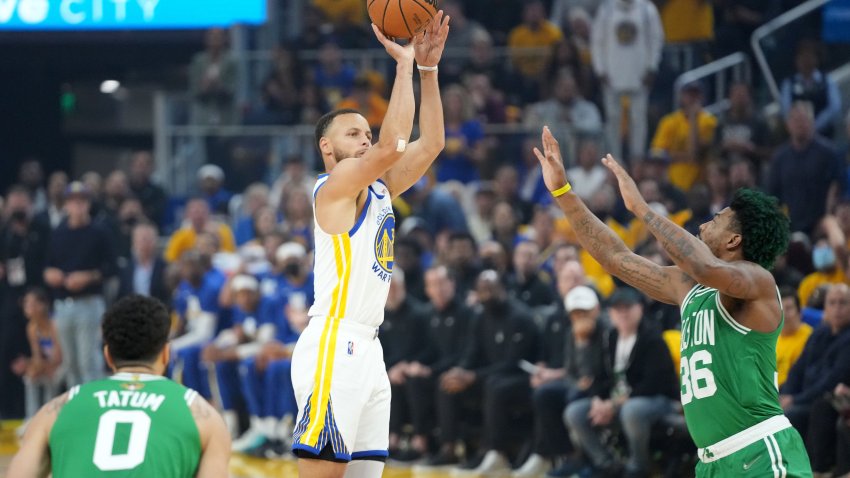 Jun 2, 2022; San Francisco, California, USA; Golden State Warriors guard Stephen Curry (center) shoots the ball over Boston Celtics guard Marcus Smart (36) during the first quarter in game one of the 2022 NBA Finals at Chase Center. Mandatory Credit: Kyle Terada-USA TODAY Sports