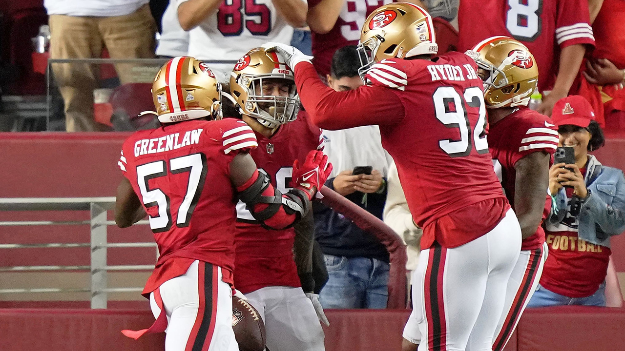 San Francisco 49ers safety Talanoa Hufanga, left, poses for photos