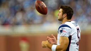 Aug 22, 2013; Detroit, MI, USA; New England Patriots quarterback Tim Tebow (5) on the sidelines in the fourth quarter of a preseason game against the Detroit Lions at Ford Field. Mandatory Credit: Andrew Weber-USA TODAY Sports