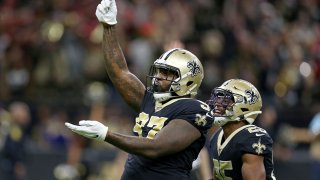 Dec 8, 2019; New Orleans, LA, USA; New Orleans Saints defensive end Mario Edwards (97) celebrates a sack with cornerback Eli Apple (25) in the second half against the San Francisco 49ers at the Mercedes-Benz Superdome. The 49ers won, 48-46. Mandatory Credit: Chuck Cook-USA TODAY Sports