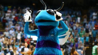 Sep 28, 2018; Chapel Hill, NC, USA; The Charlotte Hornets mascot Hugo throws t-shirts to the fans during the game against the Boston Celtics at Dean E. Smith Center. Mandatory Credit: Jeremy Brevard-USA TODAY Sports
