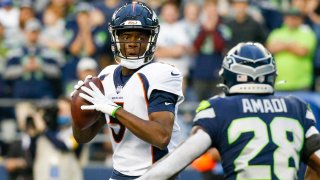 Aug 21, 2021; Seattle, Washington, USA; Denver Broncos quarterback Teddy Bridgewater (5) drops back to pass against the Seattle Seahawks during the first quarter at Lumen Field. Mandatory Credit: Joe Nicholson-USA TODAY Sports