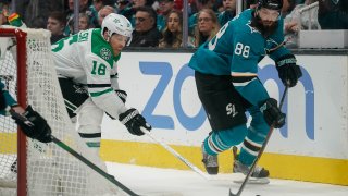 Jan 11, 2020; San Jose, California, USA; Dallas Stars center Joe Pavelski (16) and San Jose Sharks defenseman Brent Burns (88) fight for control of the puck during the third period at SAP Center at San Jose. Mandatory Credit: Stan Szeto-USA TODAY Sports