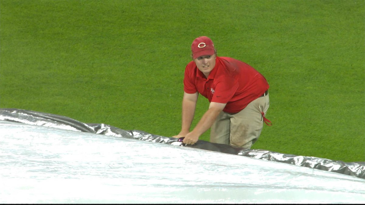 TarpGuy gets pulled under when grounds crew rolls field cover at Royals game