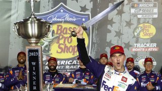 Denny Hamlin, driver of the No. 11 FedEx Freight Direct Toyota, celebrates in victory lane after winning the NASCAR Cup Series Bass Pro Shops Night Race at Bristol Motor Speedway on Sept. 16, 2023 in Bristol, Tenn.