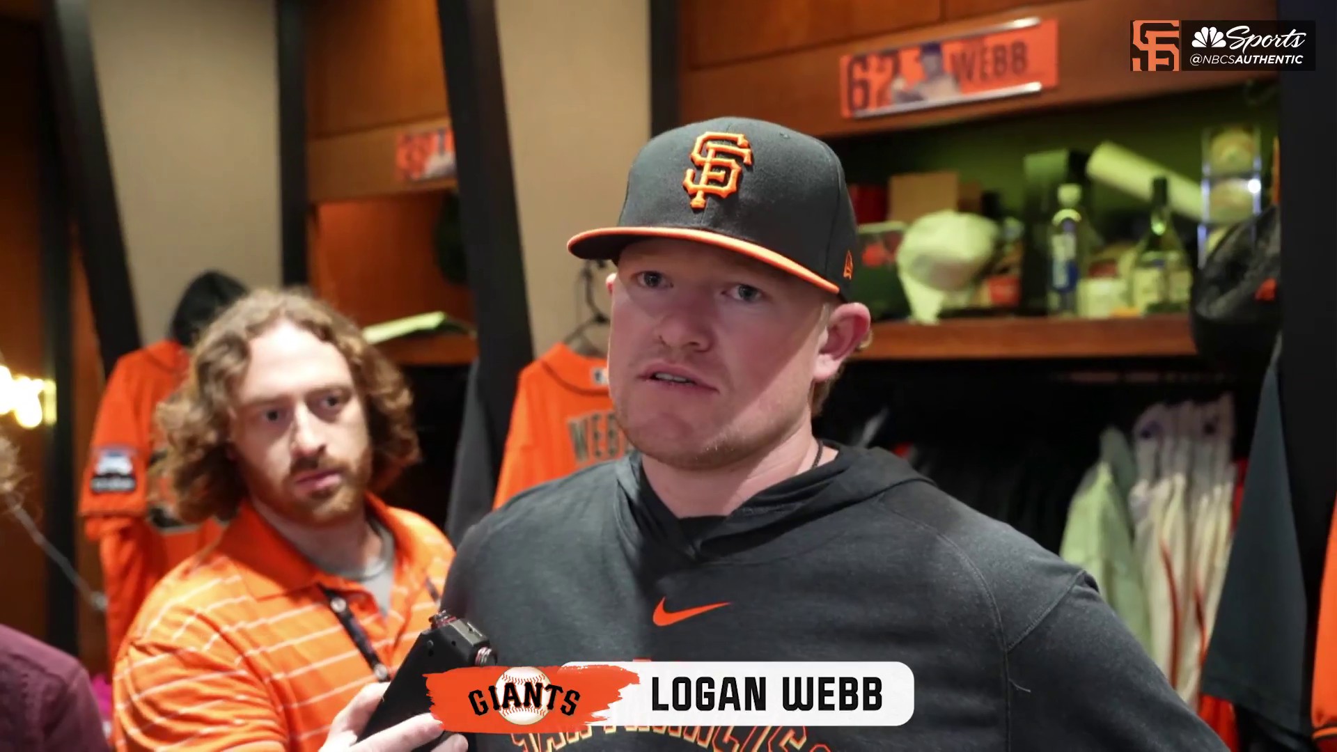 San Francisco Giants' Logan Webb wears a hat and shirt for first baseman Brandon  Belt before a baseball game between the Giants and the Arizona Diamondbacks  in San Francisco, Wednesday, Sept. 29