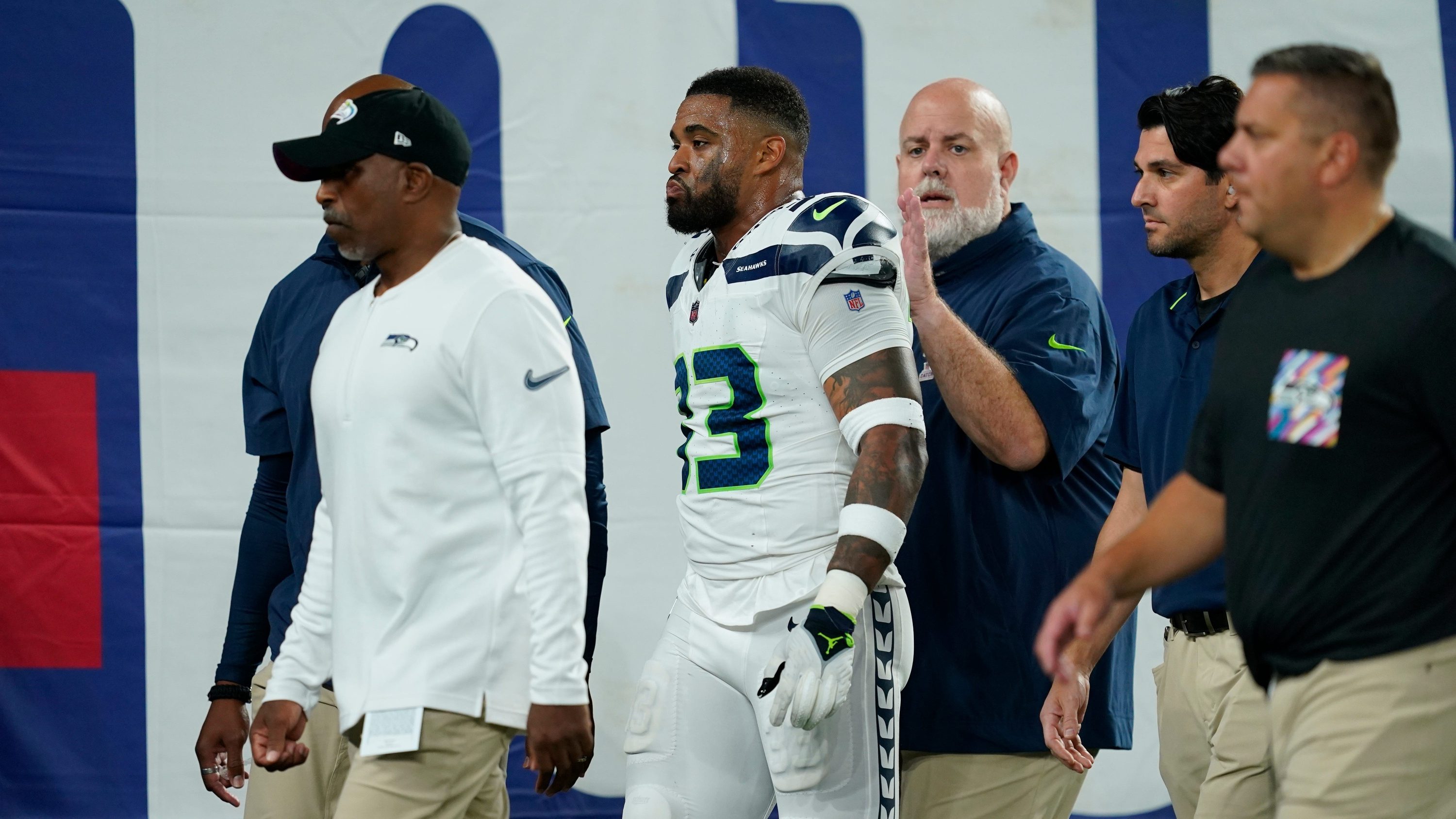 Raiders RB Marshawn Lynch sits during anthem before Rams game