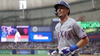 Texas Rangers left fielder Evan Carter (32) jogs back to the dugout after hitting a solo home run against the Tampa Bay Rays during the fourth inning in Game 2 of the 2023 Wild Card Series at Tropicana Field.