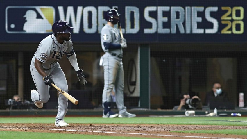 Randy Arozarena of the Tampa Bay Rays hits a single against the Los Angeles Dodgers during the fifth inning in Game 6 of the 2020 MLB World Series at Globe Life Field on Oct. 27, 2020, in Arlington, Texas.