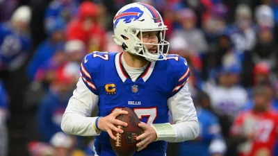 Josh Allen of the Buffalo Bills drops back to pass against the New England Patriots during the first half at Highmark Stadium on Dec. 31, 2023, in Orchard Park, New York. The Bills won 27-21.