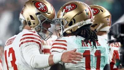 PHILADELPHIA, PENNSYLVANIA – DECEMBER 03: Brock Purdy #13 and Brandon Aiyuk #11 of the San Francisco 49ers celebrates after a touchdown during the second quarter in the game against the Philadelphia Eagles at Lincoln Financial Field on December 03, 2023 in Philadelphia, Pennsylvania. (Photo by Tim Nwachukwu/Getty Images)