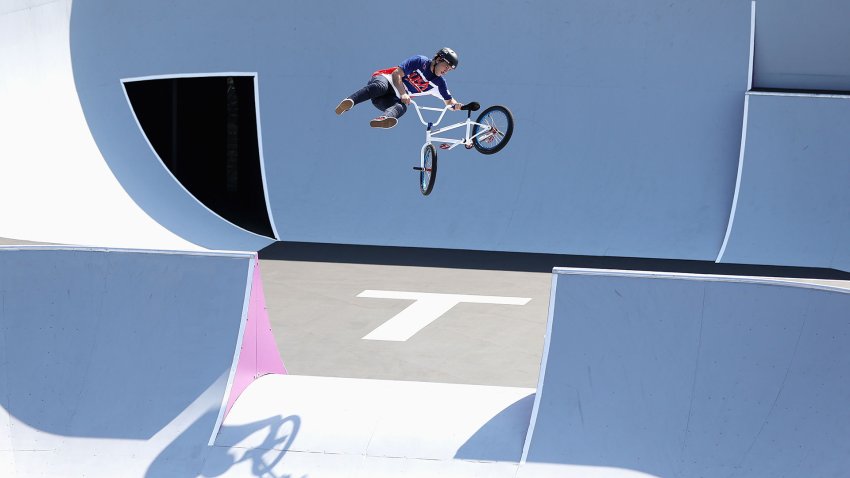 Nick Bruce executes a trick while gapping between two ramps