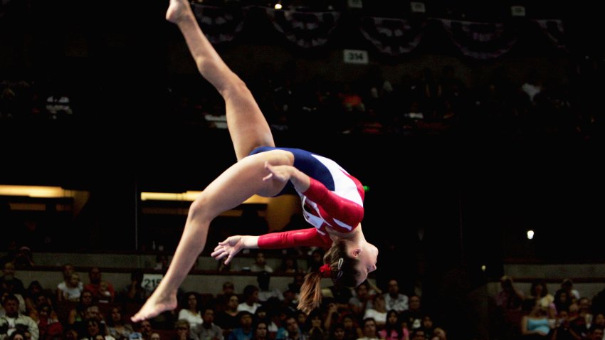 Carly Patterson competes on the balance beam the Women's preliminaries of the U.S. Gymnastics Olympic Team Trials on June 25, 2004 at The Arrowhead Pond of Anaheim in Anaheim, California.