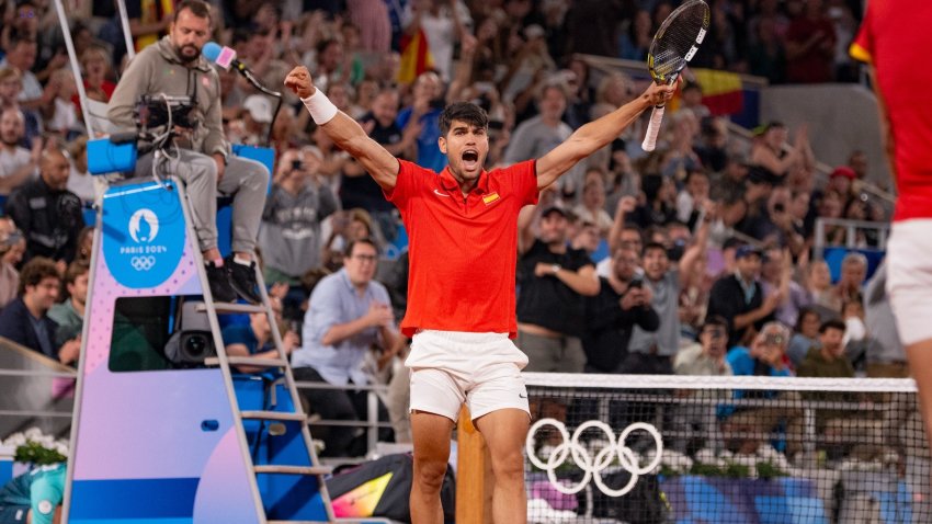 Carlos Alcaraz of Spain celebrates winning the match against team Argentina during the match between Argentina and Spain for the Men's Doubles First Round on day one of the Olympic Games Paris 2024 at Court Philippe-Chatrier on July 27, 2024 in Paris, France.