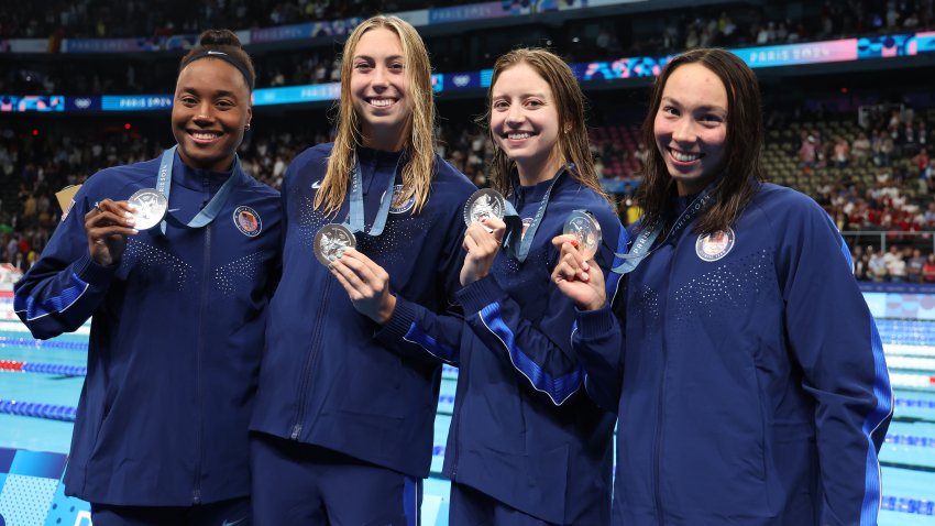 NANTERRE, FRANCE – JULY 27: Silver Medalists, Kate Douglass, Gretchen Walsh, Torri Huske and Simone Manuel of Team United States pose with their medals during the Medal Ceremony after the Women’s 4x100m Freestyle Relay Final on day one of the Olympic Games Paris 2024 at Paris La Defense Arena on July 27, 2024 in Nanterre, France. (Photo by Ian MacNicol/Getty Images)