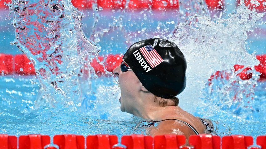 US’ Katie Ledecky celebrates after winning the final of the women’s 1500m freestyle swimming event during the Paris 2024 Olympic Games at the Paris La Defense Arena in Nanterre, west of Paris, on July 31, 2024.