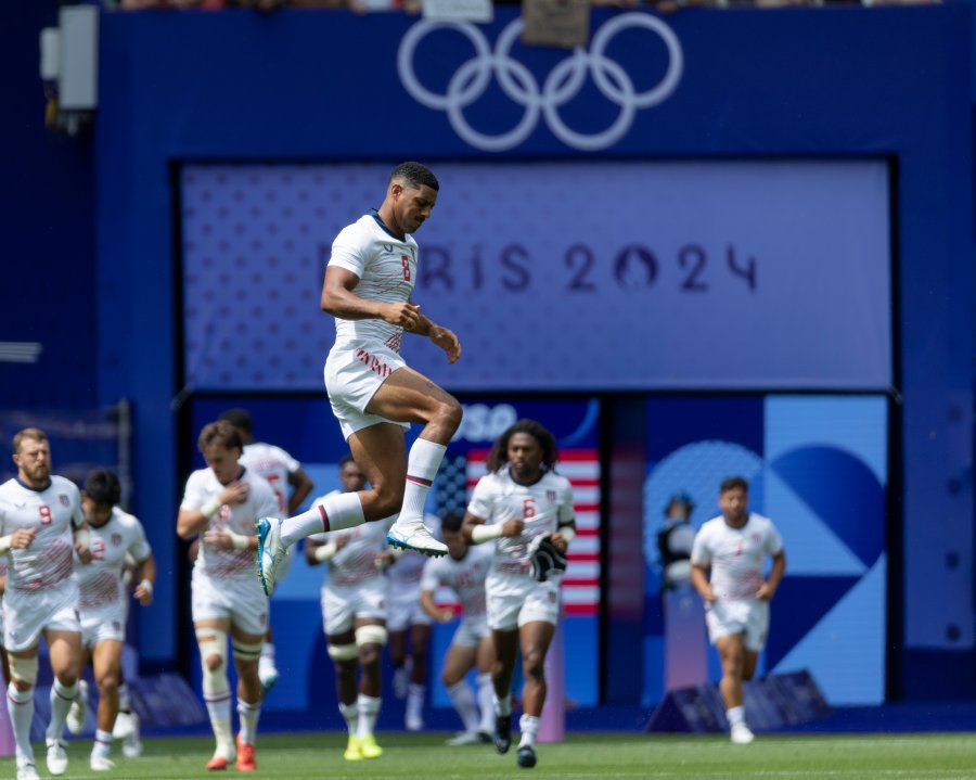 Malacchi Esdale #8 of the USA Men's National Team leaps as the team enters the pitch during a men's Pool C match