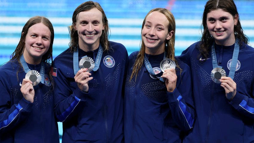 Silver Medalists Claire Weinstein, Paige Madden, Katie Ledecky and Erin Gemmell of Team United States pose with their medals