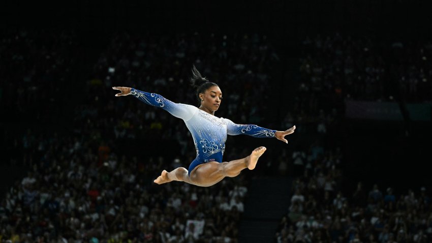 The U.S.’ Simone Biles competes in the artistic gymnastics women’s balance beam final during the Paris 2024 Olympic Games at the Bercy Arena in Paris, on August 5, 2024. (Photo by Gabriel BOUYS / AFP) (Photo by GABRIEL BOUYS/AFP via Getty Images)