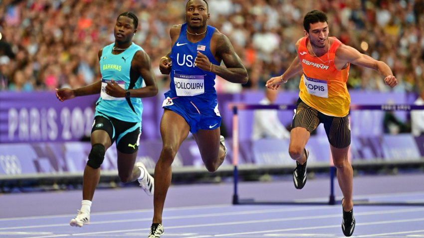 Grant Holloway runs during track and field event at Paris Olympics