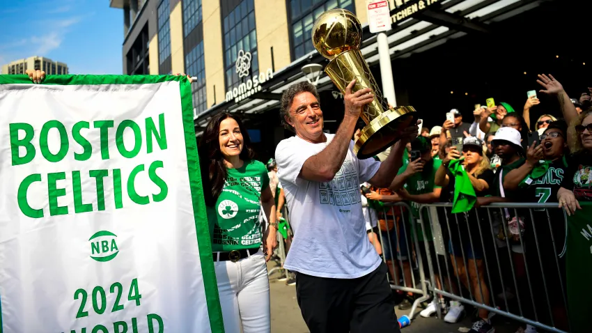 Celtics owner Wyc Grousbeck holds the Larry O'Brien Championship Trophy during the championship parade