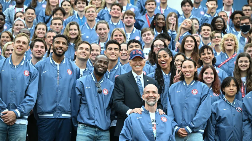 President Joe Biden poses for a photo with US athletes during an event celebrating the 2024 US Olympic and Paralympic teams on the South Lawn of the White House in Washington, DC, September 30, 2024.