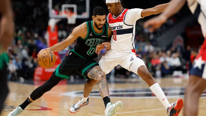 Oct 24, 2024; Washington, District of Columbia, USA; Boston Celtics forward Jayson Tatum (0) drives to the basket as Washington Wizards guard Bilal Coulibaly (0) defends in the first half at Capital One Arena. Mandatory Credit: Geoff Burke-Imagn Images