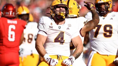 TUCSON, ARIZONA – NOVEMBER 30: Running back Cam Skattebo #4 of the Arizona State Sun Devils celebrates after scoring a touchdown against the Arizona Wildcats during the first half of the NCAAF game at Arizona Stadium on November 30, 2024 in Tucson, Arizona. (Photo by Kelsey Grant/Getty Images)