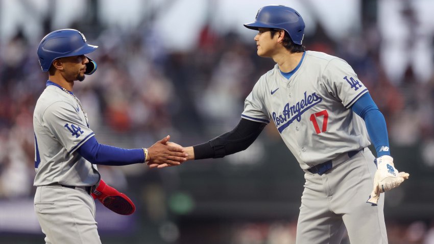 Shohei Ohtani shakes hands with Mookie Betts