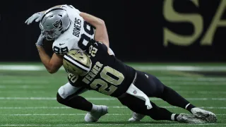 Pete Werner of the New Orleans Saints tackles Brock Bowers of the Las Vegas Raiders