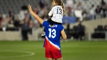 COLUMBUS, OH - APRIL 10: Alex Morgan #13 of the United States waves to fans with her daughter Charlie looking on after the SheBelieves Cup game between Canada and the United States at Lower.com Field on April 10, 2024 in Columbus, Ohio. (Photo by Michael Miller/ISI Photos/Getty Images)