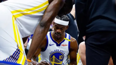 Feb 21, 2025; Sacramento, California, USA; Golden State Warriors forward Jimmy Butler III (10) draws on a board with forward Draymond Green (23) during the second quarter against the Sacramento Kings at Golden 1 Center. Mandatory Credit: Sergio Estrada-Imagn Images