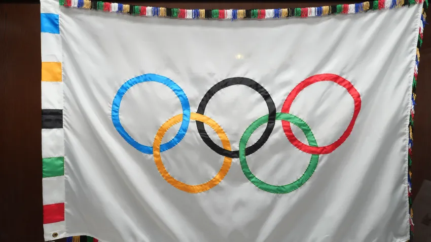 LOS ANGELES, CALIFORNIA – SEPTEMBER 23: The LA2028 official Olympic flag at Los Angeles City Hall on September 23, 2024 in Los Angeles, California. (Photo by Kirby Lee/Getty Images)