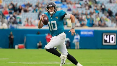 Jacksonville Jaguars quarterback Mac Jones (10) rushes for yards during the fourth quarter Sunday, Dec. 29, 2024 at EverBank Stadium in Jacksonville, Fla. The Jaguars held off the Titans 20-13. [Corey Perrine/Florida Times-Union]