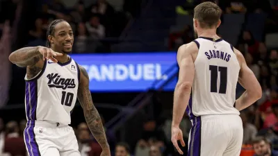 NEW ORLEANS, LOUISIANA – FEBRUARY 12: DeMar DeRozan #10 of the Sacramento Kings and Domantas Sabonis #11 celebrate after a basket against the New Orleans Pelicans during the first half of a game at the Smoothie King Center on February 12, 2025 in New Orleans, Louisiana.  NOTE TO USER: User expressly acknowledges and agrees that, by downloading and or using this photograph, User is consenting to the terms and conditions of the Getty Images License Agreement. (Photo by Derick E. Hingle/Getty Images)