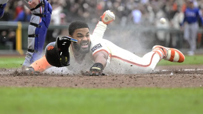 SAN FRANCISCO, CALIFORNIA – APRIL 27: Heliot Ramos #17 of the San Francisco Giants scores for the game winning run on an infield single and error on the throw to first base against the Texas Rangers in the ninth inning at Oracle Park on April 27, 2025 in San Francisco, California. (Photo by Eakin Howard/Getty Images)
