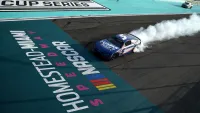 Kyle Larson celebrates with a burnout