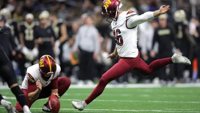 NEW ORLEANS, LOUISIANA – DECEMBER 15: Greg Joseph #46 of the Washington Commanders kicks a field goal during the fourth quarter against the New Orleans Saints at Caesars Superdome on December 15, 2024 in New Orleans, Louisiana. (Photo by Jonathan Bachman/Getty Images)