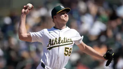 May 7, 2025; West Sacramento, California, USA; Athletics pitcher Noah Murdock (58) delivers a pitch against the Seattle Mariners during the eighth inning at Sutter Health Park. Mandatory Credit: D. Ross Cameron-Imagn Images
