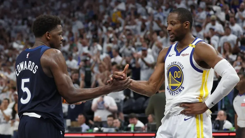 MINNEAPOLIS, MINNESOTA – MAY 14: Anthony Edwards #5 of the Minnesota Timberwolves shakes hands with Jonathan Kuminga #00 of the Golden State Warriors after winning Game Five of the Western Conference Second Round NBA Playoffs at Target Center on May 14, 2025 in Minneapolis, Minnesota. NOTE TO USER: User expressly acknowledges and agrees that, by downloading and or using this photograph, User is consenting to the terms and conditions of the Getty Images License Agreement. (Photo by Ellen Schmidt/Getty Images)
