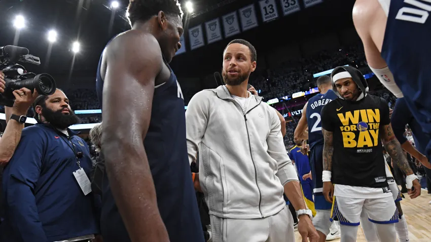 MINNEAPOLIS, MN –  MAY 14: Stephen Curry #30 of the Golden State Warriors hugs Anthony Edwards #5 of the Minnesota Timberwolves after the game during Round 2 Game 5 of the 2025 NBA Playoffs on May 14, 2025 at Target Center in Minneapolis, Minnesota. NOTE TO USER: User expressly acknowledges and agrees that, by downloading and or using this Photograph, user is consenting to the terms and conditions of the Getty Images License Agreement. Mandatory Copyright Notice: Copyright 2025 NBAE (Photo by Noah Graham/NBAE via Getty Images)