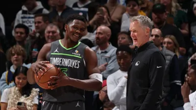 MINNEAPOLIS, MN –  DECEMBER 21: Anthony Edwards #5 of the Minnesota Timberwolves and Head Coach Steve Kerr of the Golden State Warriors look on before the game on December 21, 2024 at Target Center in Minneapolis, Minnesota. NOTE TO USER: User expressly acknowledges and agrees that, by downloading and or using this Photograph, user is consenting to the terms and conditions of the Getty Images License Agreement. Mandatory Copyright Notice: Copyright 2024 NBAE (Photo by David Sherman/NBAE via Getty Images)