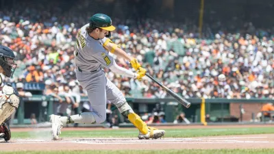 May 18, 2025; San Francisco, California, USA; Oakland Athletics shortstop Jacob Wilson (5) doubles during the first inning against the San Francisco Giants at Oracle Park. Mandatory Credit: Bob Kupbens-Imagn Images