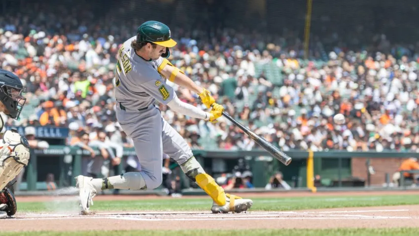May 18, 2025; San Francisco, California, USA; Oakland Athletics shortstop Jacob Wilson (5) doubles during the first inning against the San Francisco Giants at Oracle Park. Mandatory Credit: Bob Kupbens-Imagn Images